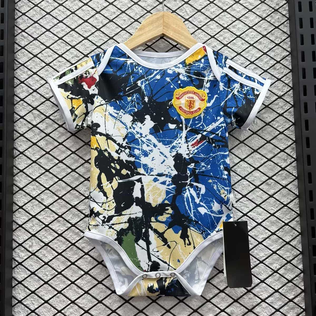 01-140.jpg Manchester United 2026-27 Stone Roses Baby Jersey - Image 1